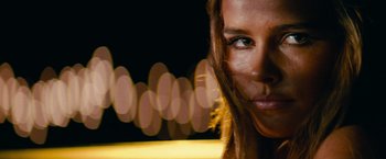 Movie still from “Transformers: Revenge of the Fallen” (2009), directed by Michael Bay – The face of a beautiful young woman; Close Up shot, Over the shoulder angle
