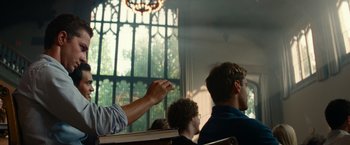 Movie still from “Transformers: Revenge of the Fallen” (2009), directed by Michael Bay – A man pointing to something in a church; Medium shot, Low angle