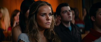 Movie still from “Transformers: Revenge of the Fallen” (2009), directed by Michael Bay – A woman and a man are sitting in a room together; Close Up shot, Over the shoulder angle