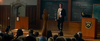 Movie still from “Transformers: Revenge of the Fallen” (2009), directed by Michael Bay – A man standing in front of a crowd of people; Wide shot, Over the shoulder angle