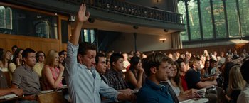 Movie still from “Transformers: Revenge of the Fallen” (2009), directed by Michael Bay – A group of people sitting in front of an audience; Medium shot, Low angle