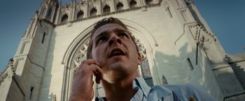 Movie still from “Transformers: Revenge of the Fallen” (2009), directed by Michael Bay – A person talking on a cell phone; Close Up shot, Low angle