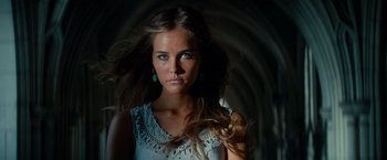Movie still from “Transformers: Revenge of the Fallen” (2009), directed by Michael Bay – A beautiful young woman with long brown hair and blue eyes; Close Up shot, Low angle
