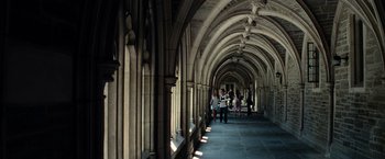Movie still from “Transformers: Revenge of the Fallen” (2009), directed by Michael Bay – A group of people walking down a long hallway; Extreme Wide shot, High angle