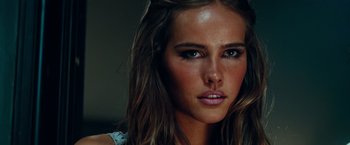 Movie still from “Transformers: Revenge of the Fallen” (2009), directed by Michael Bay – A woman's face with brown eyes; Close Up shot, Over the shoulder angle
