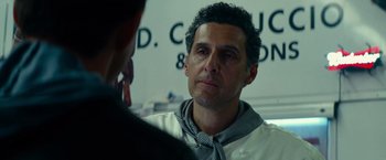 Movie still from “Transformers: Revenge of the Fallen” (2009), directed by Michael Bay – A person wearing a neck tie; Close Up shot, Over the shoulder angle