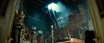 Movie still from “Transformers: Revenge of the Fallen” (2009), directed by Michael Bay – A room filled with lots of boxes and a fire hydrant; Wide shot, Low angle