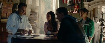 Movie still from “Transformers: Revenge of the Fallen” (2009), directed by Michael Bay – A group of people sitting around a table; Medium shot, Over the shoulder angle