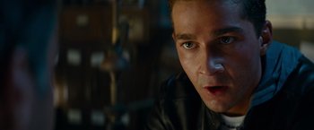 Movie still from “Transformers: Revenge of the Fallen” (2009), directed by Michael Bay – A person wearing a leather jacket; Close Up shot, High angle