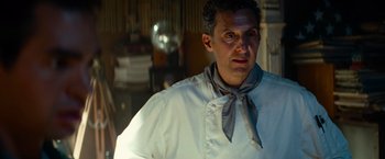 Movie still from “Transformers: Revenge of the Fallen” (2009), directed by Michael Bay – A man wearing a white shirt and a blue and white neck tie; Close Up shot, Over the shoulder angle