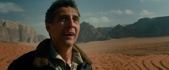 Movie still from “Transformers: Revenge of the Fallen” (2009), directed by Michael Bay – A middle aged man standing in the middle of the desert; Close Up shot, Low angle