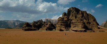 Movie still from “Transformers: Revenge of the Fallen” (2009), directed by Michael Bay – A person standing in the middle of a desert; Extreme Wide shot, High angle
