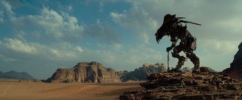 Movie still from “Transformers: Revenge of the Fallen” (2009), directed by Michael Bay – An image of a desert scene with mountains in the background; Extreme Wide shot, Low angle