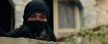 Movie still from “Transformers: Revenge of the Fallen” (2009), directed by Michael Bay – A woman in a black head scarf and a black head scarf; Close Up shot, Over the shoulder angle