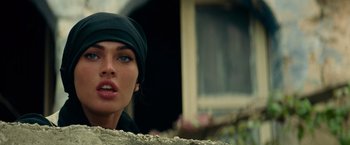 Movie still from “Transformers: Revenge of the Fallen” (2009), directed by Michael Bay – A person wearing a hat; Close Up shot, Low angle