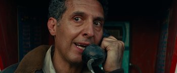 Movie still from “Transformers: Revenge of the Fallen” (2009), directed by Michael Bay – A person talking on a phone; Close Up shot, Low angle