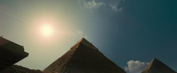 Movie still from “Transformers: Revenge of the Fallen” (2009), directed by Michael Bay – A person standing on top of a hill with the sun in the background; Extreme Wide shot, Low angle