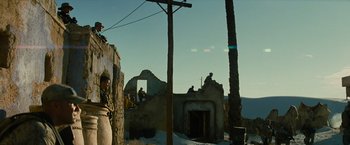 Movie still from “Transformers: Revenge of the Fallen” (2009), directed by Michael Bay – A couple of men standing on top of a brick building; Extreme Wide shot, Low angle