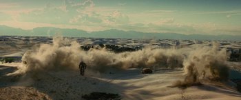 Movie still from “Transformers: Revenge of the Fallen” (2009), directed by Michael Bay – A dirt bike and a car in the desert; Extreme Wide shot, Low angle