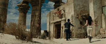 Movie still from “Transformers: Revenge of the Fallen” (2009), directed by Michael Bay – A man standing in front of an abandoned building; Wide shot, Low angle