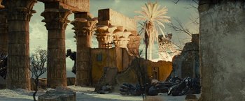 Movie still from “Transformers: Revenge of the Fallen” (2009), directed by Michael Bay – An old building with a palm tree in front of it; Extreme Wide shot, Low angle
