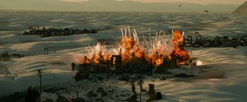 Movie still from “Transformers: Revenge of the Fallen” (2009), directed by Michael Bay – An image of an explosion in the middle of the desert; Extreme Wide shot, High angle