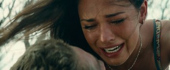 Movie still from “Transformers: Revenge of the Fallen” (2009), directed by Michael Bay – A person with a dog crying; Close Up shot, Low angle