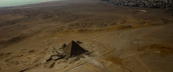 Movie still from “Transformers: Revenge of the Fallen” (2009), directed by Michael Bay – An aerial view of a pyramid in the middle of the desert; Extreme Wide shot, High angle