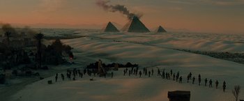 Movie still from “Transformers: Revenge of the Fallen” (2009), directed by Michael Bay – A group of people standing in the snow near some pyramids; Extreme Wide shot, High angle