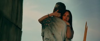 Movie still from “Transformers: Revenge of the Fallen” (2009), directed by Michael Bay – A man and a woman embracing each other; Close Up shot, Low angle