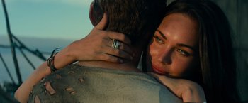 Movie still from “Transformers: Revenge of the Fallen” (2009), directed by Michael Bay – A man and a woman embracing each other; Close Up shot, Over the shoulder angle