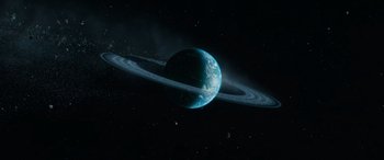 Movie still from “Transformers: Rise of the Beasts” (2023), directed by Steven Caple Jr. – An image of an earth in the night sky; Extreme Wide shot, Overhead angle