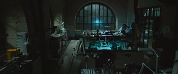 Movie still from “Transformers: Rise of the Beasts” (2023), directed by Steven Caple Jr. – A room filled with lots and lots of tables and chairs; Extreme Wide shot, High angle