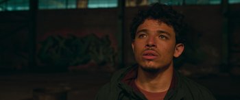 Movie still from “Transformers: Rise of the Beasts” (2023), directed by Steven Caple Jr. – A person looking up at the sky; Close Up shot, Low angle