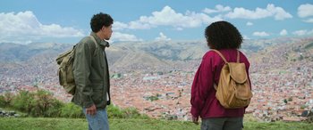 Movie still from “Transformers: Rise of the Beasts” (2023), directed by Steven Caple Jr. – A man and a woman looking out over a city; Medium shot, Over the shoulder angle