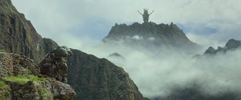 Movie still from “Transformers: Rise of the Beasts” (2023), directed by Steven Caple Jr. – A large mountain with a strange creature on top of it; Extreme Wide shot, Low angle