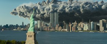 Movie still from “Transformers: Rise of the Beasts” (2023), directed by Steven Caple Jr. – The statue of liberty in front of the twin towers in new york city; Extreme Wide shot, Low angle