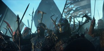 Movie still from “Transformers: The Last Knight” (2017), directed by Michael Bay – A group of men in armor and helmets with swords; Medium shot, Low angle
