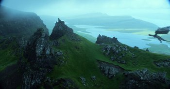 Movie still from “Transformers: The Last Knight” (2017), directed by Michael Bay – A view of a mountain with a river in the background; Extreme Wide shot, High angle