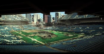 Movie still from “Transformers: The Last Knight” (2017), directed by Michael Bay – An aerial view of a baseball field with a city skyline in the background; Extreme Wide shot, High angle