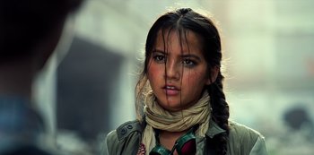 Movie still from “Transformers: The Last Knight” (2017), directed by Michael Bay – A young woman with long black hair wearing a scarf; Close Up shot, Low angle