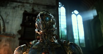 The face of a robot in front of a stained glass window