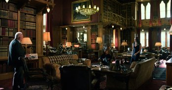 Movie still from “Transformers: The Last Knight” (2017), directed by Michael Bay – A living room filled with lots of furniture and lamps; Extreme Wide shot, High angle