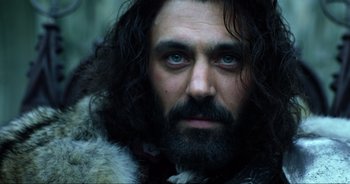 Movie still from “Transformers: The Last Knight” (2017), directed by Michael Bay – A person with a beard; Close Up shot, Low angle