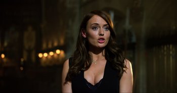 Movie still from “Transformers: The Last Knight” (2017), directed by Michael Bay – A beautiful woman with long brown hair wearing a black dress; Close Up shot, Over the shoulder angle