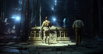 Movie still from “Transformers: The Last Knight” (2017), directed by Michael Bay – A man standing in front of an altar in a dark room; Wide shot, Low angle