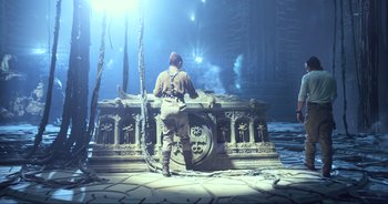 Movie still from “Transformers: The Last Knight” (2017), directed by Michael Bay – A man standing in front of a statue in the water; Wide shot, Low angle