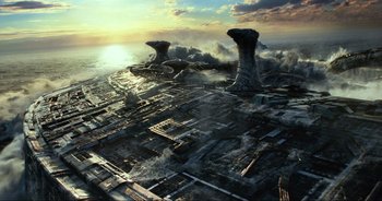 Movie still from “Transformers: The Last Knight” (2017), directed by Michael Bay – An aerial view of a city with a sky background; Extreme Wide shot, High angle