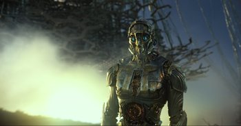 Movie still from “Transformers: The Last Knight” (2017), directed by Michael Bay – An image of a man that is standing up; Medium shot, Low angle