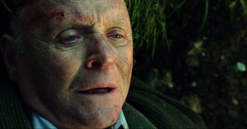 Movie still from “Transformers: The Last Knight” (2017), directed by Michael Bay – An old man with a bruise on his face; Close Up shot, High angle